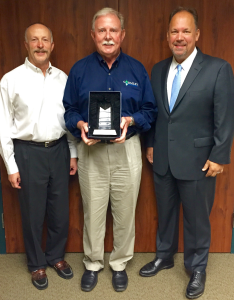 Ed Gormley (center) is pictured with Peter Hofstetter, CEO of WVMC (left), and Mark Medley, EVP, President of Hospital Operations for Capella (right).